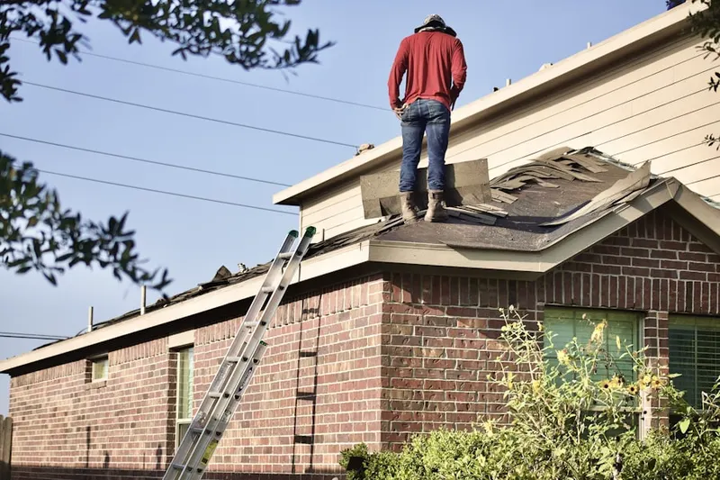 Professional roofer working on a residential roof in Peoria Polynesian Village